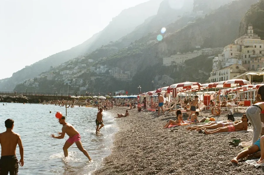 A film photograph of a crowded Positano beach.