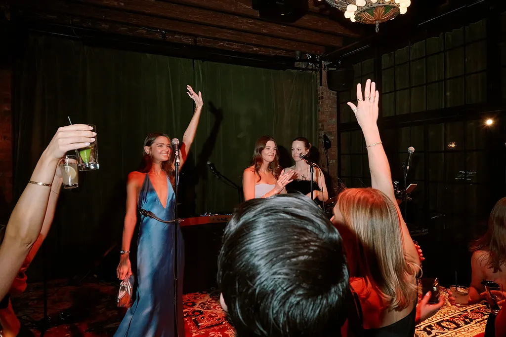Hands in the air for the singers on stage.